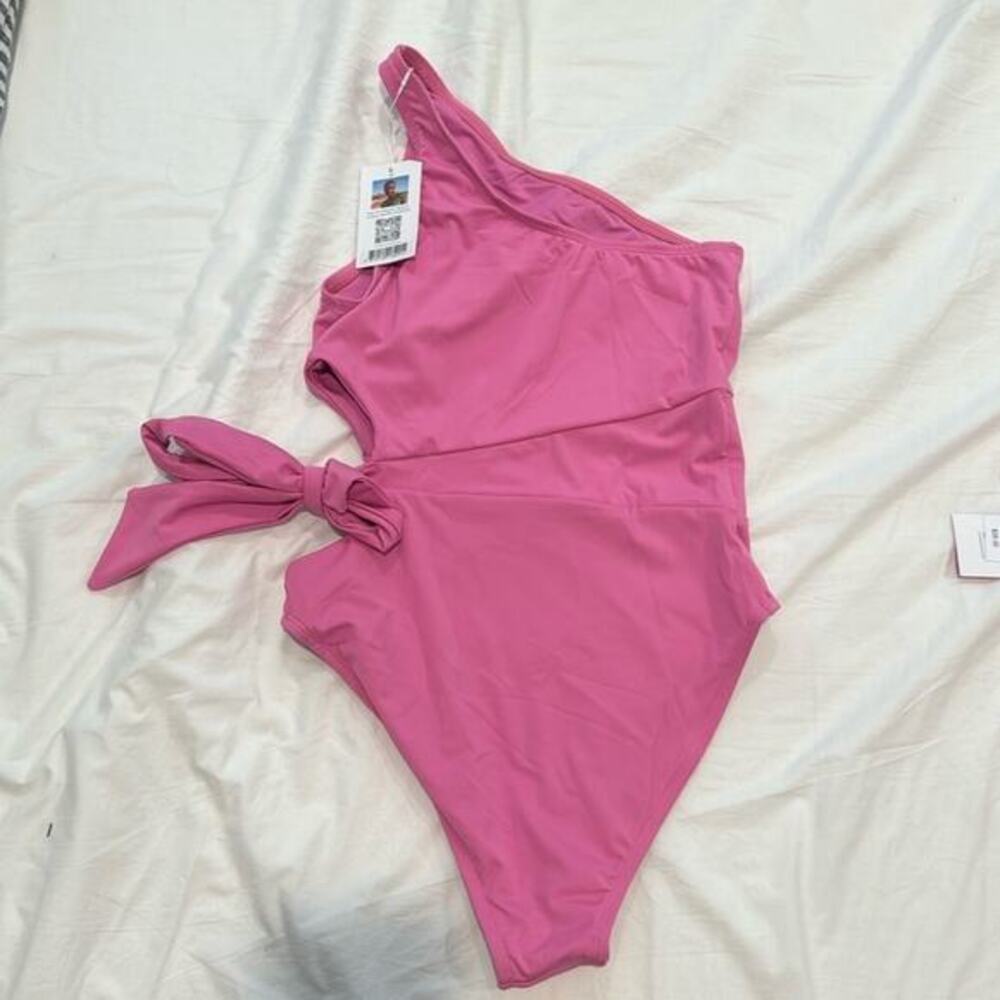 Brand new with tags pink medium one piece swim‎ suit with cute side opening